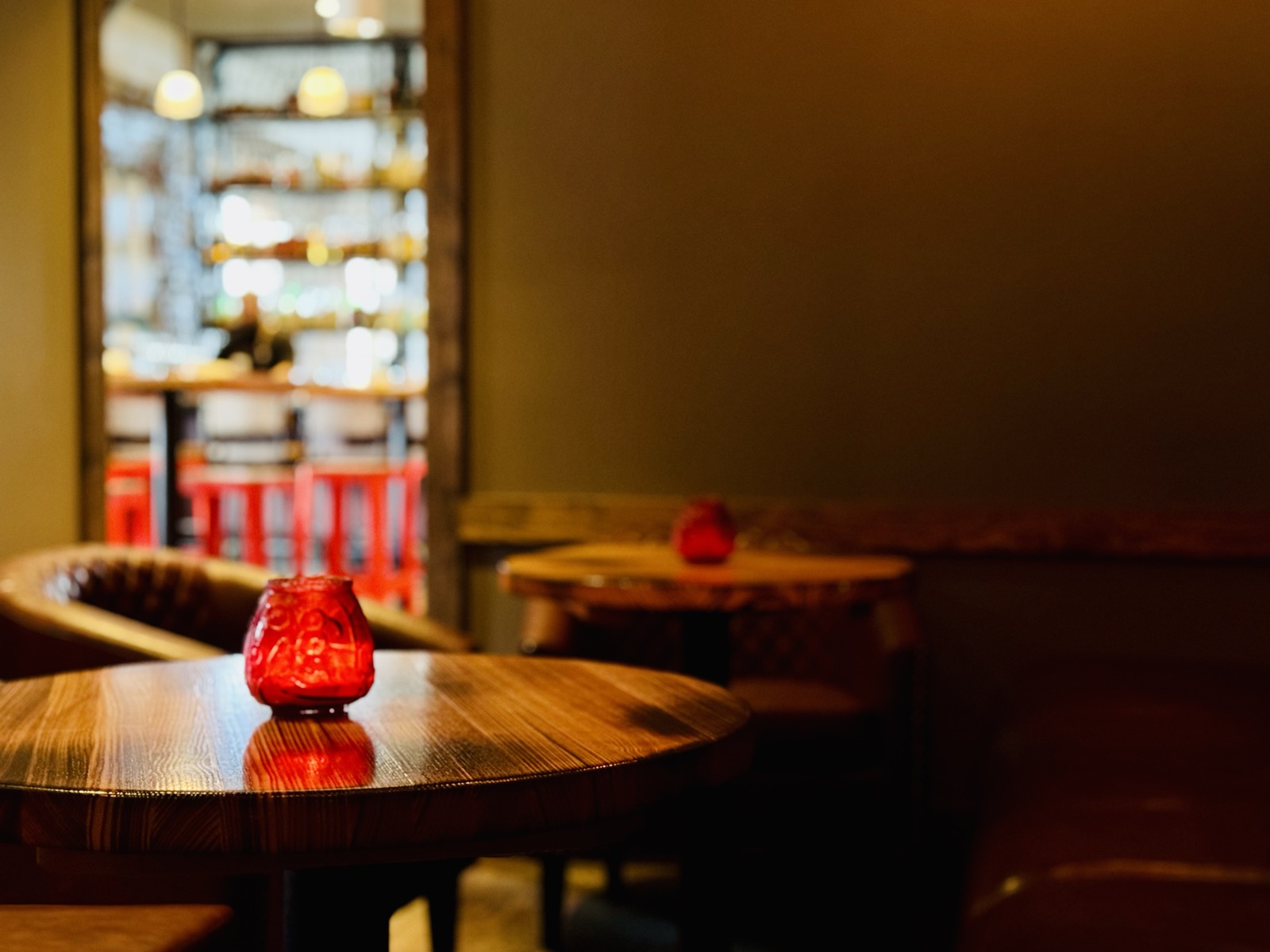 Cozy dining tables with red votive candles